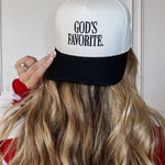 The God’s Favorite Trucker Hat is a bold embroidered women’s trucker hat—perfect for casual streetwear, weekend outfits, and trendy boutique accessories.